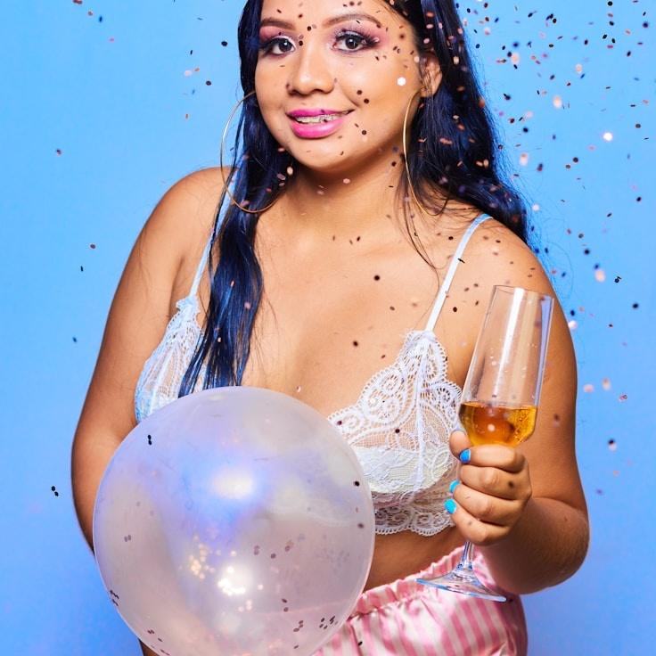 Asha Rao, Lead Design Curator at Kernel Matrix Byte, reviewing corporate floral arrangements